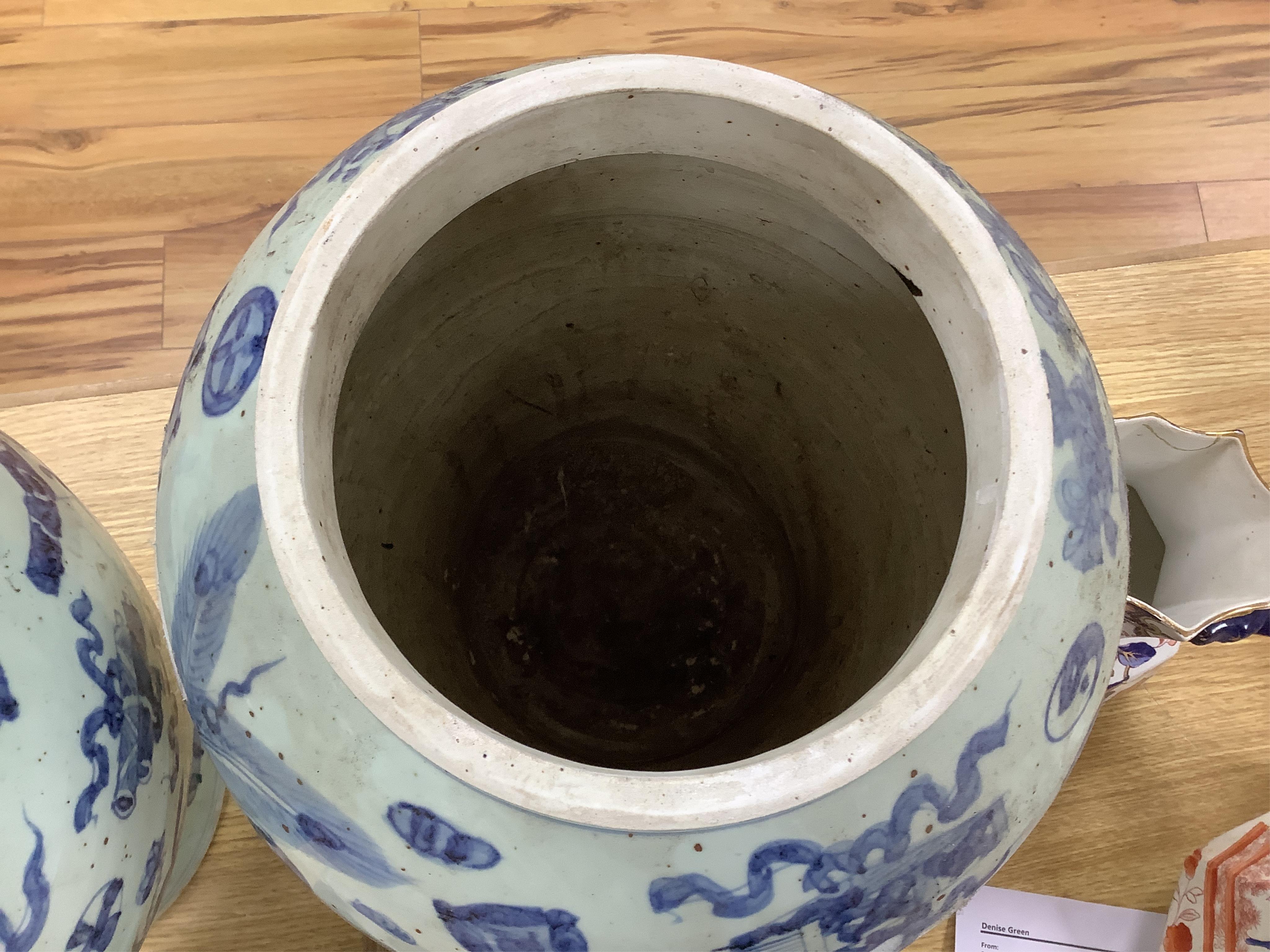 A large pair of Chinese blue and white ginger jars and covers, 54cm high. Condition - fair to good